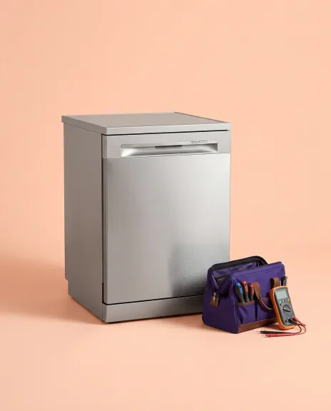Stainless steel dishwasher with a technician tool bag beside it